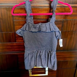 Old Navy top color is navy blue. Has never been worn